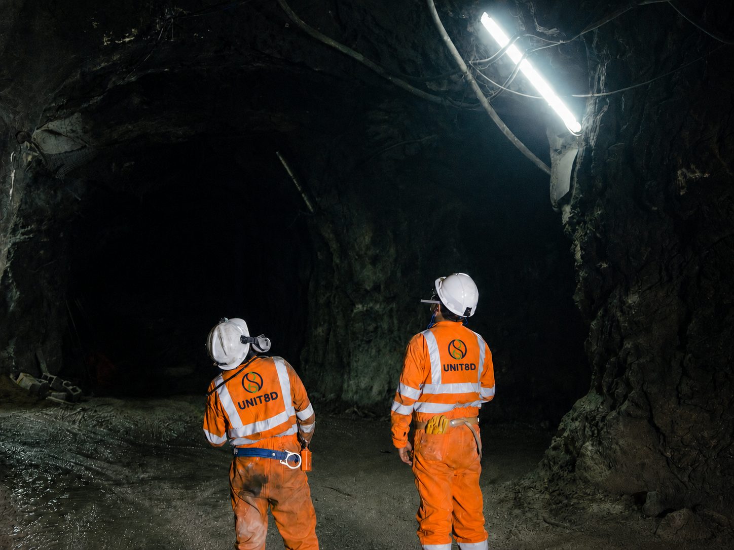 Two UNIT8D operatives inspecting a tunnel in a confined underground worksite